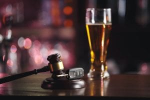 gavel, car keys and beer mug