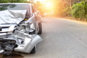 heavily damaged red car